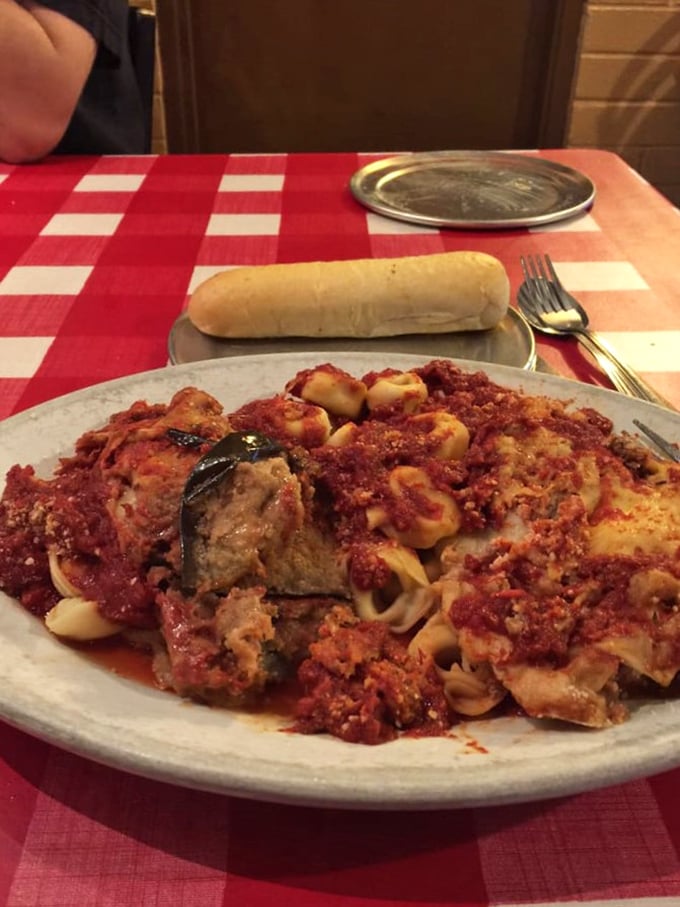 A plate that proves some family recipes are worth keeping secret - layers of pasta, sauce, and tradition served with a side of nostalgia.