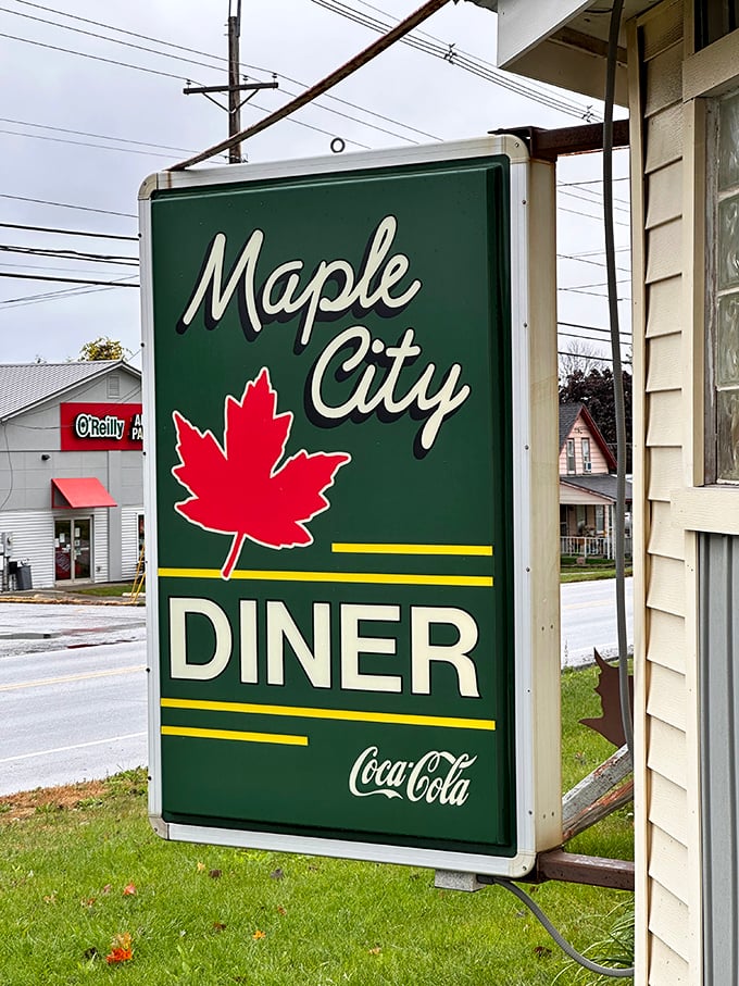 Small town charm, big time flavor! Maple City Diner's sign promises a syrupy journey your taste buds won't soon forget.