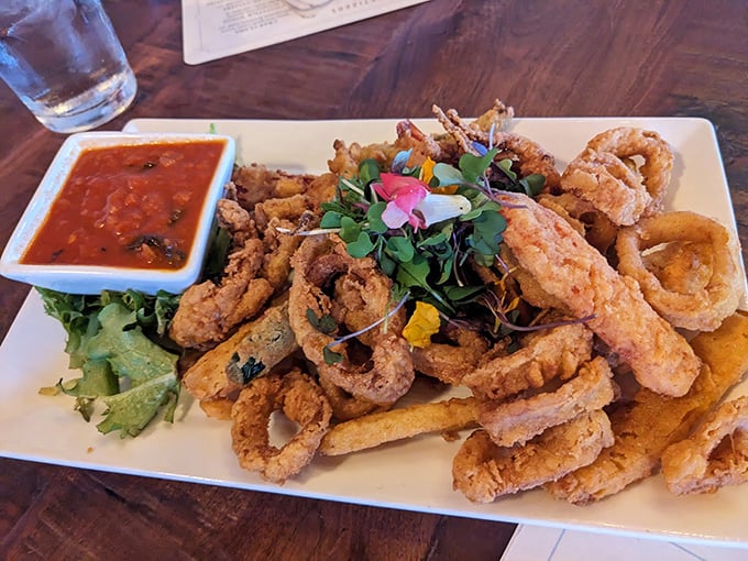 Calamari that could make Poseidon himself swim to shore! Crispy, tender, and more addictive than your favorite Netflix series. Photo credit: John Bomba