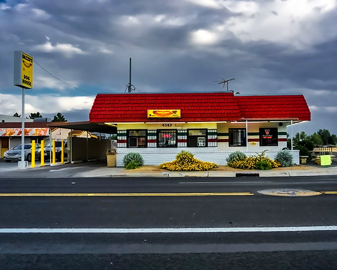 Dazzo's at dusk: As the sun sets, this humble hot dog haven transforms into a neon-lit oasis for wiener enthusiasts.