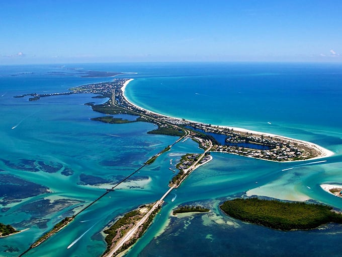 Boca Grande: Where luxury meets laid-back island vibes. This aerial view showcases a perfect blend of upscale living and natural beauty.