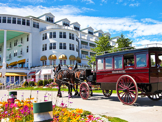 Horse-drawn carriages and Victorian charm? The Grand Hotel on Mackinac Island is basically a time machine with a really long porch.