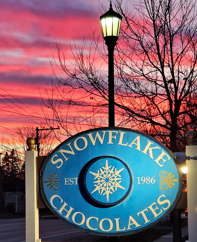 Twilight delight! Snowflake Chocolates' sign glows like a beacon for night owls with a sweet tooth.