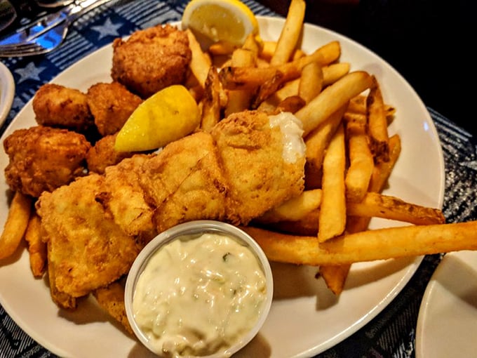 Golden-fried seafood and crispy fries – the kind of plate that makes you wish you had a second stomach. Photo credit: John K.