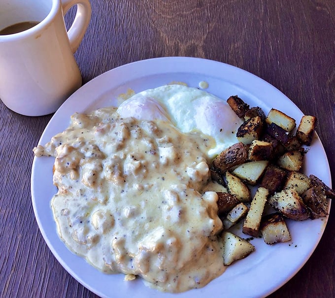 Gravy train coming through! This plate of biscuits and gravy looks like it could cure everything from a broken heart to a stubborn hangnail.