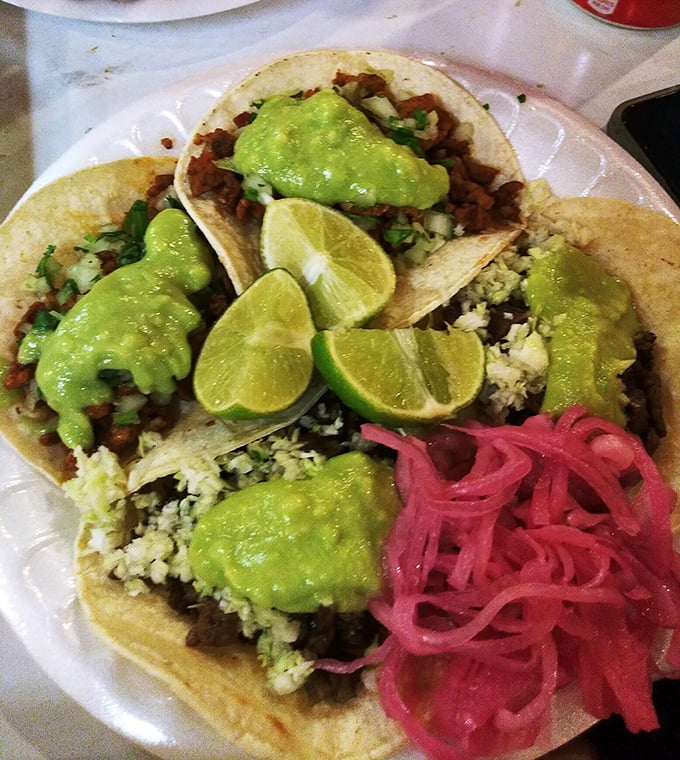 Holy guacamole! This carne asada taco is piled high with green goodness. It's like a flavor fiesta in every bite.