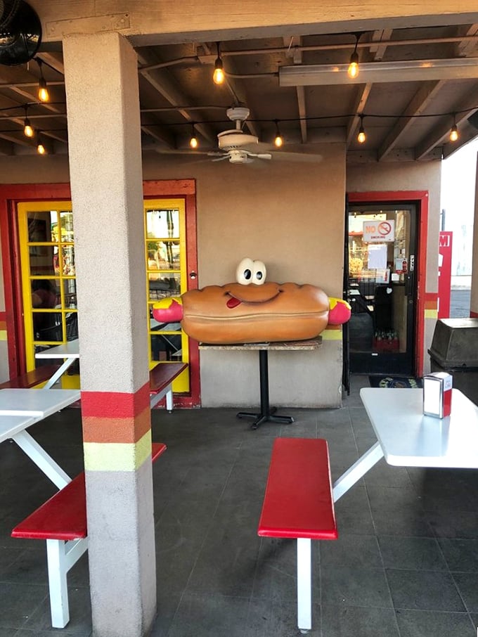 Outdoor seating with a side of whimsy. That hot dog statue is giving me serious 