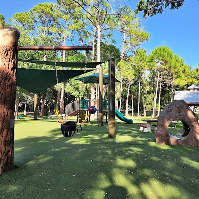 Playground paradise! Where kids' imaginations run wild and parents wish they could shrink. It's like Willy Wonka designed a jungle gym.