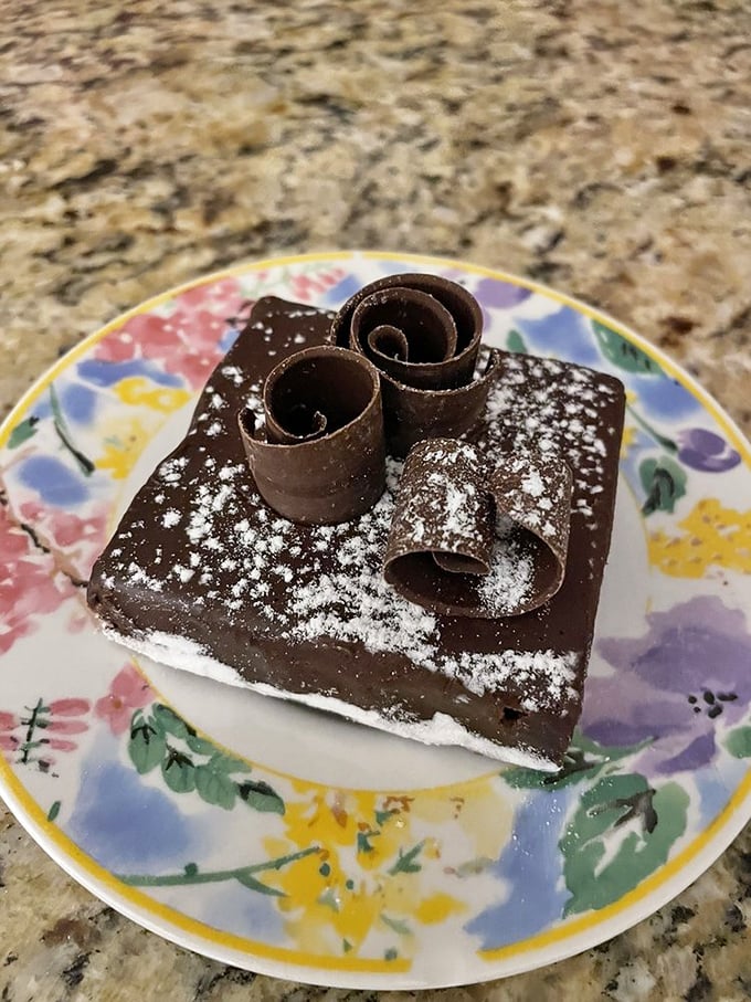 Brownie perfection achieved! This chocolate square topped with delicate curls is like a love letter to cocoa. Be still, my beating heart!