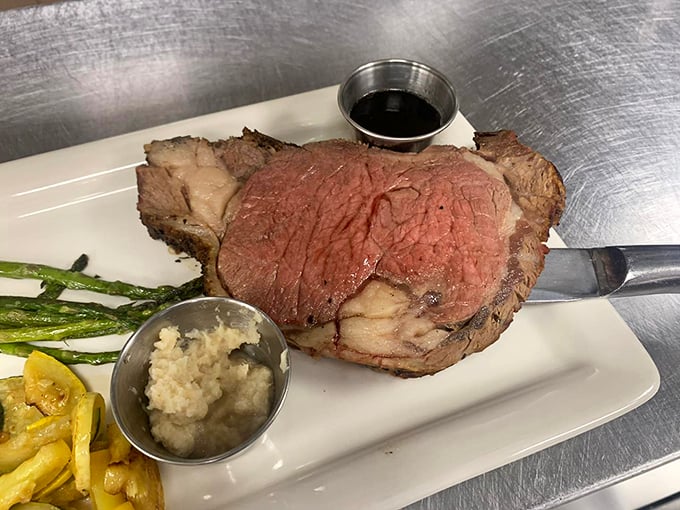 A plate that screams "treat yo' self!" Prime rib takes center stage, flanked by its trusty sidekicks: crisp asparagus and a baked potato that's basically a meal in itself.