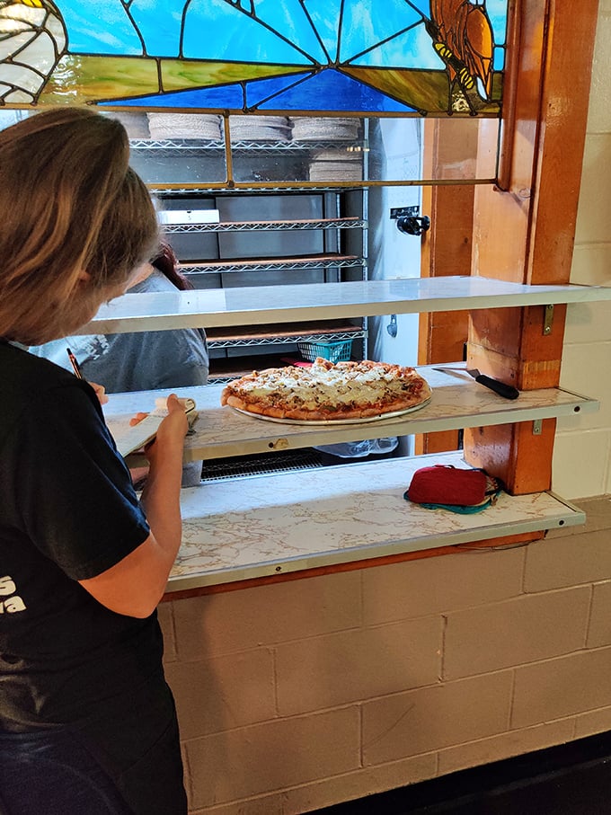 The kitchen: where magic happens and calories don't count. A glimpse into the pizza-making process that'll make your mouth water.