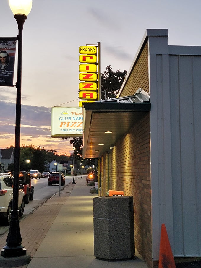 As the sun sets, Frank's neon sign lights up like a beacon of hope for the hungry. Pizza night, anyone?