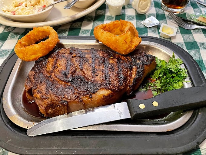 This isn't just a pork chop, it's a meaty masterpiece. Juicy, charred, and big enough to make Fred Flintstone jealous.