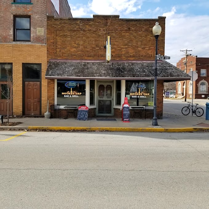 Cheers to small-town charm! Rocket Tap's facade might be humble, but inside, it's serving up cold brews and warm conversations faster than you can say "local haunt."