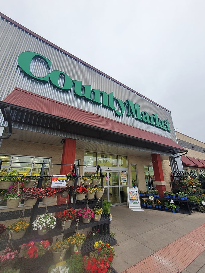 Flower power meets grocery glory! County Market's blooming entrance is like Mother Nature decided to give your shopping cart a warm, colorful hug.