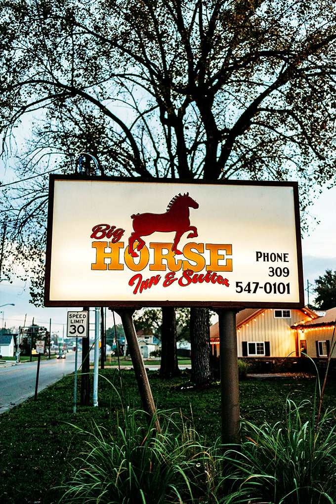 Neigh-ver judge a book by its cover! The Big Horse Inn & Suites sign promises a stay that's equal parts quirky and cozy. Saddle up for a unique experience!