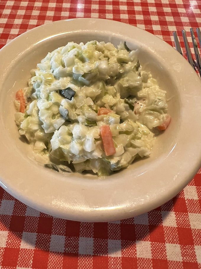 Coleslaw: the unsung hero of diner cuisine. This creamy, crunchy concoction isn't just a side dish; it's a cool, crisp counterpoint to all that delicious grease.