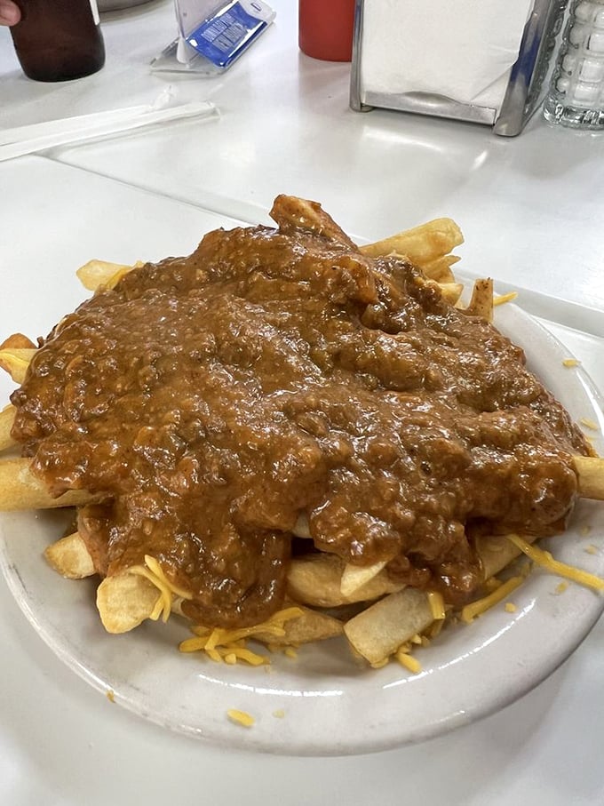 Chili cheese fries: Where comfort food meets cardiac adventure. It's a cheesy, meaty avalanche that'll warm your soul and expand your waistline.