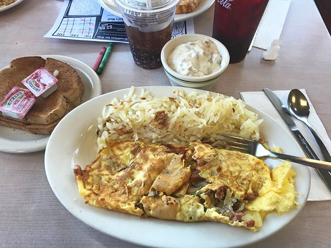 This isn't just an omelet, it's an edible work of art. Packed with more fillings than your grandma's photo album, it's a breakfast lover's dream come true.