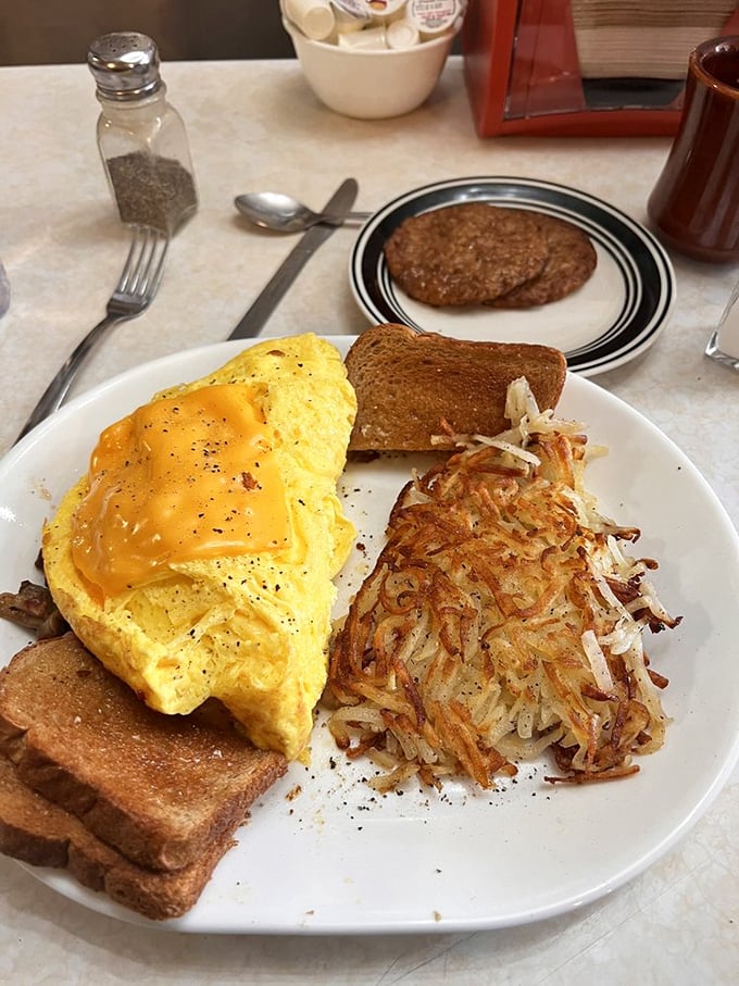 Golden hash browns and a cheese-draped omelet: proof that not all heroes wear capes, some wield spatulas.