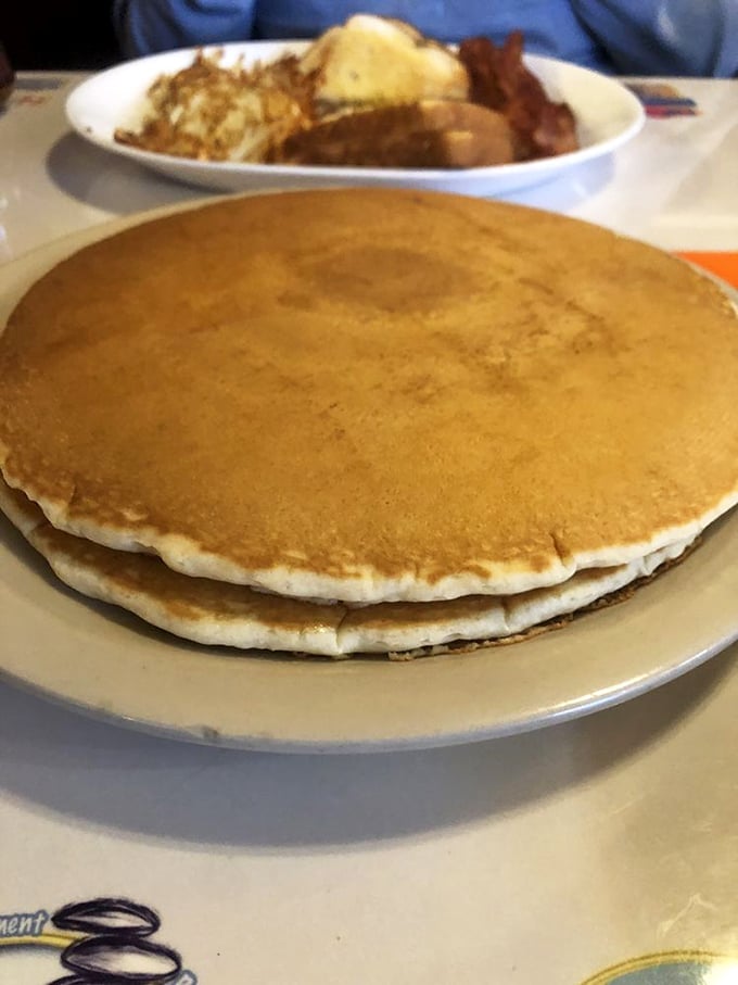 Pancakes wider than your smile after the first bite. These fluffy discs are what breakfast dreams are made of.