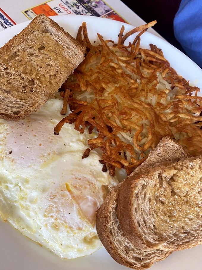 A breakfast platter that could make Ron Swanson weep with joy. Eggs, hash browns, and toast: the holy trinity of morning feasts.