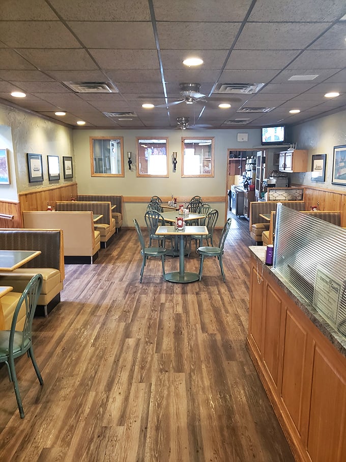 Step into a time machine disguised as a diner. This cozy interior has witnessed more family gatherings than a Thanksgiving turkey.