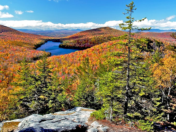 Autumn's masterpiece unfolds! Mother Nature's gone wild with her paintbrush, turning Kettle Pond into a kaleidoscope of reds, oranges, and golds.