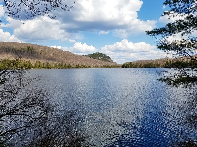 Mirror, mirror on the pond! Kettle Pond's glassy surface reflects the surrounding hills like nature's own Instagram filter.