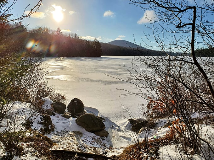 Winter's frosty masterpiece! Kettle Pond transforms into a sparkling snow globe, perfect for your next "chill" adventure.