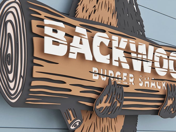 The wooden sign looks like it was carved by a hungry lumberjack with excellent taste in typography and burgers. Photo credit: Backwoods Burger Shack