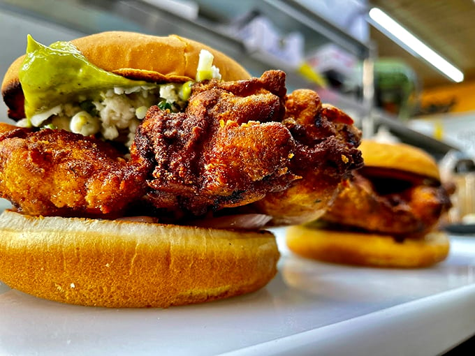 These aren't just chicken sandwiches – they're crispy, golden-brown masterpieces that would make Colonel Sanders hang up his white suit in defeat. Photo credit: Backwoods Burger Shack