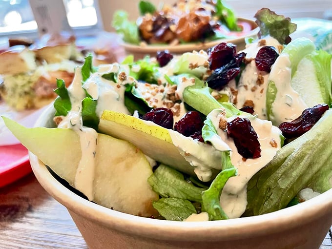 A fresh garden salad that proves even lumberjacks need their greens, dressed with cranberries for that perfect Maine touch. Photo credit: Backwoods Burger Shack