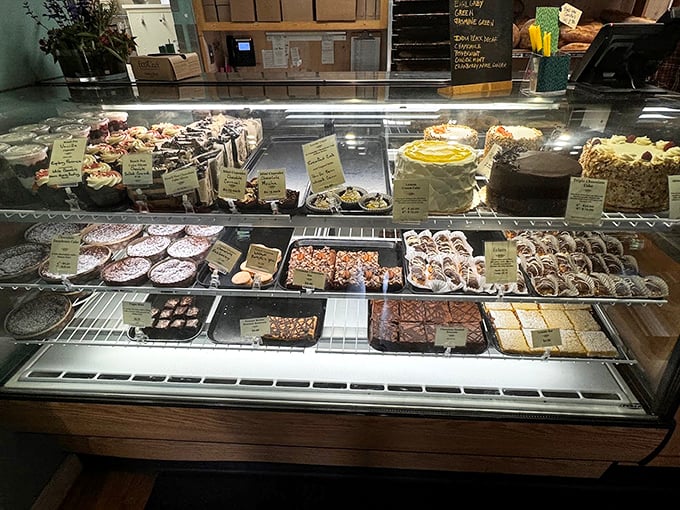 A display case that could make Willy Wonka jealous, featuring everything from decadent cakes to chocolate-drizzled treats. Photo credit: Dave H