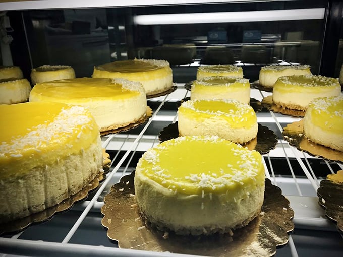 Lemon cheesecakes topped with sunshine-yellow curd and coconut, looking like they just won a beauty pageant for desserts. Photo credit: Monica A.