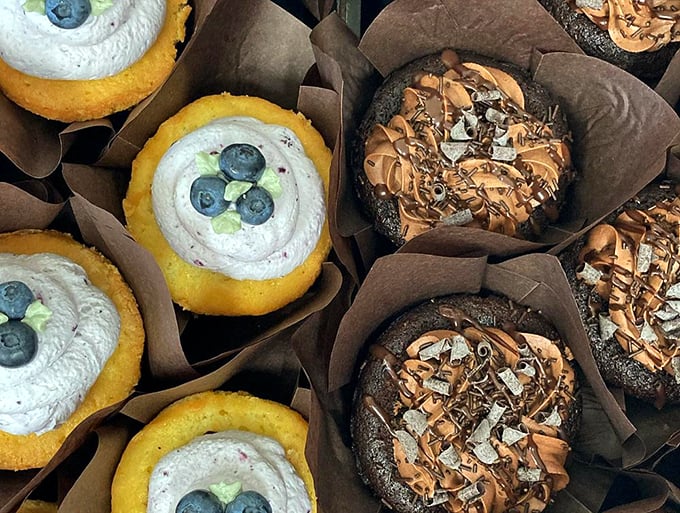 Cupcakes that strike the perfect balance between elegant and playful, topped with fresh berries and chocolate shavings. Photo credit: Beach Pea Baking Co