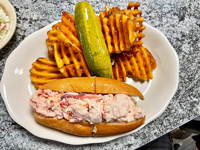 When waffle fries meet their match: a lobster roll so generous, it makes you wonder if they're trying to empty the ocean. Photo credit: Chris Bock