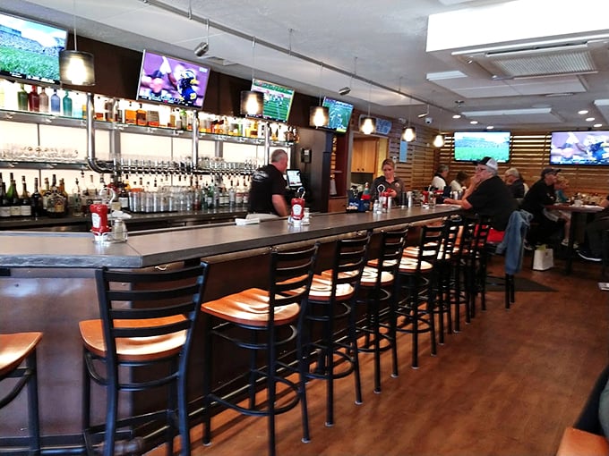 The well-stocked bar area offers a cozy retreat where locals and visitors alike gather to share stories and seafood. Photo credit: Steve Lucas (Colorado Steve)