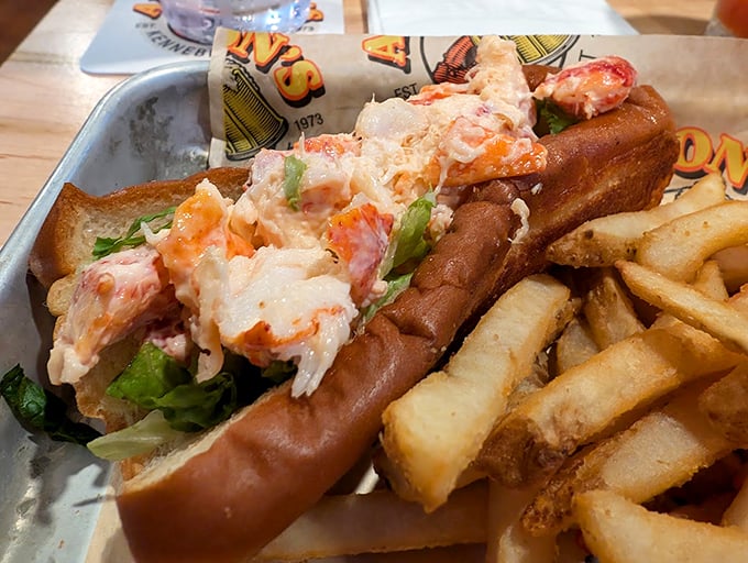 A perfectly toasted roll cradles sweet Maine lobster meat, creating the quintessential summer sandwich that dreams are made of. Photo credit: Jason