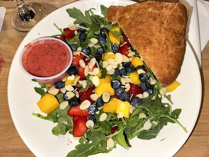 A vibrant summer salad bursting with fresh berries, mangoes, and almonds proves seafood isn't the only star here. Photo credit: Ashley S.