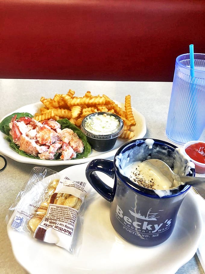 A perfect Maine pairing: Steaming clam chowder alongside a lobster roll, served in Becky's signature blue mug. Photo credit: Melissa F.