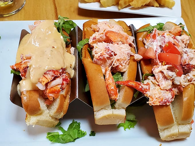 These lobster rolls aren't just sandwiches – they're edible love letters from the ocean, each one bursting with sweet, succulent meat. Photo credit: Ken Mejia