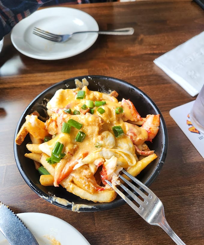 Golden fries smothered in lobster and cheese sauce – because sometimes you need your comfort food to wear a tuxedo. Photo credit: D L