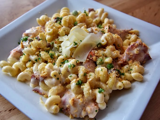 Mac and cheese gets a luxurious upgrade with tender lobster meat and a golden crown of breadcrumbs. Photo credit: Convinced Photography