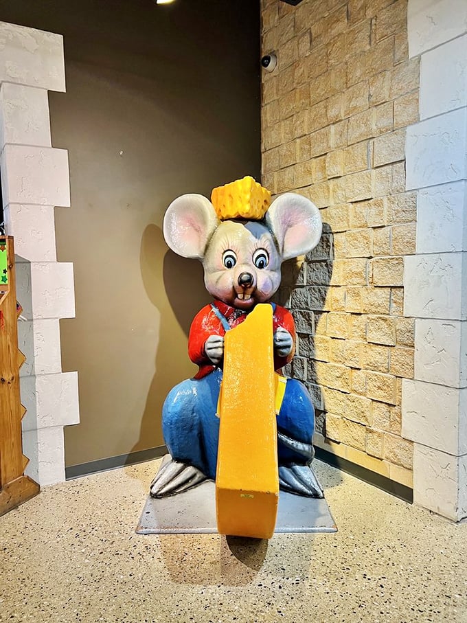 Meet the castle's resident cheese guardian! This whimsical mouse statue is ready for your selfies and your offerings of cheddar. 