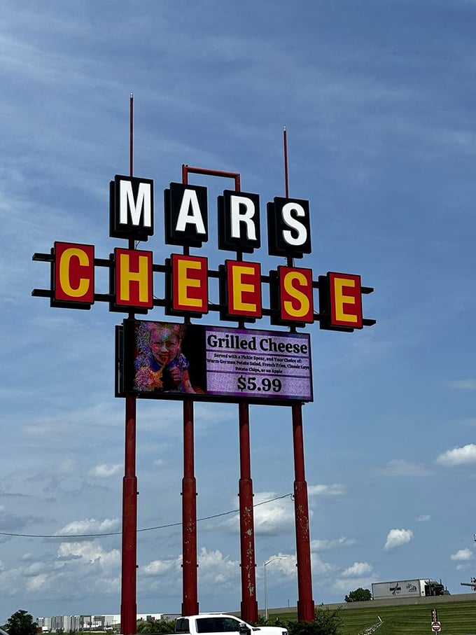 A beacon of hope for hungry travelers, this sign promises salvation in the form of gooey, grilled cheese goodness. 