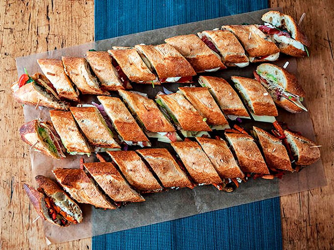 Sandwich perfection on parade! These baguette beauties are loaded with more layers than a winter wardrobe in Maine. Lunchtime just got a serious upgrade. Photo credit: Beach Pea Baking Co