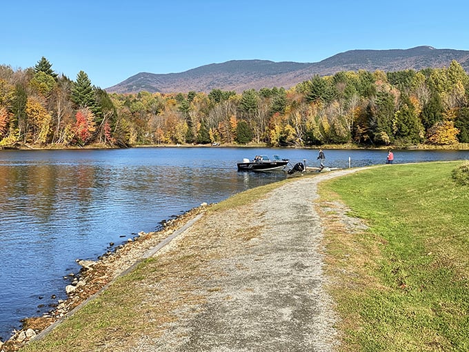 Nature's mirror: Waterbury Center State Park reflects autumn's fiery palette, inviting you to dive into a world where reality outshines your screensaver.