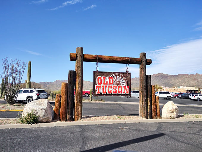 Howdy, partner! This rustic sign isn't just welcoming you to Old Tucson – it's inviting you to star in your own Western adventure.