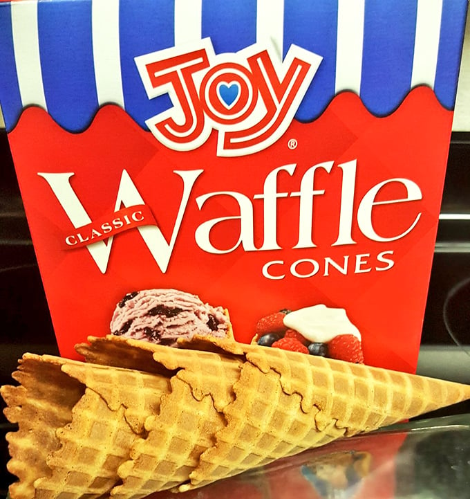 Waffle cones, assemble! These crispy cups are lined up like delicious soldiers, ready for their creamy deployment.